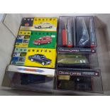 A small collection of boxed diecast models comprising three Vanguard 1:43 scale,