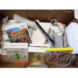 A Nintendo Wii game console with balance board, sound bar accessories, Nunchuk, WiiFit book,