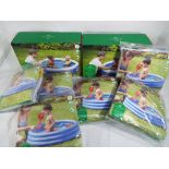 A quantity of eight unused paddling pools still sealed in original packaging (unused retail stock,