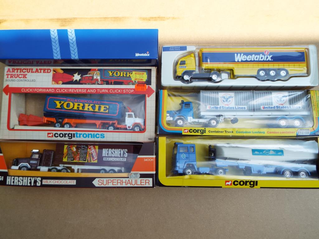 A collection of Corgi Container Trucks comprising #1107 US Lines, #1109 Aral, # 3400H Hershey's,