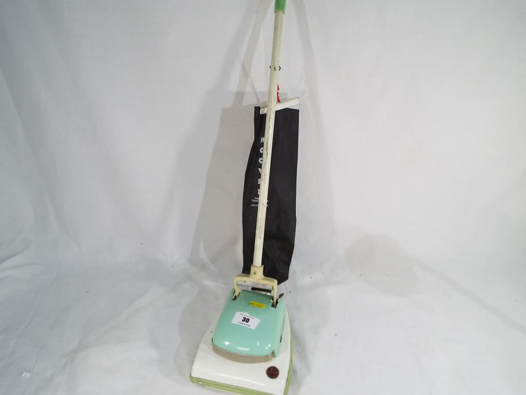 A child's battery operated Hoover vacuum cleaner by A Wells & Co - Est £20 - £40