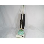 A child's battery operated Hoover vacuum cleaner by A Wells & Co - Est £20 - £40