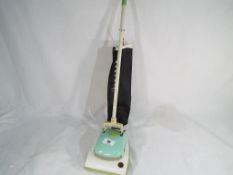 A child's battery operated Hoover vacuum cleaner by A Wells & Co - Est £20 - £40