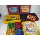 A vintage selection of boxed games to include 'Check-a-Peg',