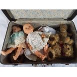 A good lot to include a suitcase containing a quantity of dolls and teddy bears,