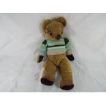 An antique straw filled mohair teddy bear approximately 58 cm (h)
