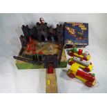 An early wooden toy fortress with model soldiers and a wooden Pull-Along goods train,