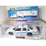 UT Models - a 1:18 scale model Chicago Police Car and a Matchbox SuperKings model Peterbuilt