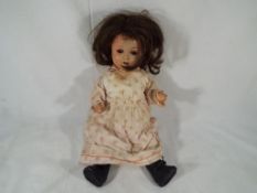 Dolls - a bisque headed Armand Marseille doll dressed doll with jointed limbs,