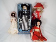 Dolls - a good quality Royal Doulton dressed ceramic doll in its presentation box,