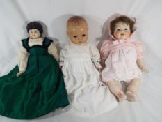 Dolls - a bisque headed dressed doll with jointed limbs, sleeping eyes,