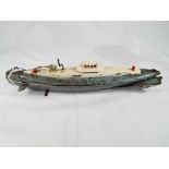 An unusual post war Japanese produced tinplate clockwork submarine 32 cm (length) in grey and cream