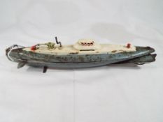 An unusual post war Japanese produced tinplate clockwork submarine 32 cm (length) in grey and cream