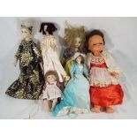 Dolls - A collection of vintage and antique dressed dolls to include a porcelain dressed doll with