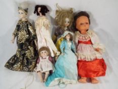 Dolls - A collection of vintage and antique dressed dolls to include a porcelain dressed doll with