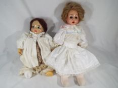 Dolls - a ceramic headed dressed doll with ceramic hands, glass eyes,