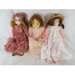 Dolls - an antique dressed doll with built in crier to the stomach, sleeping eyes,