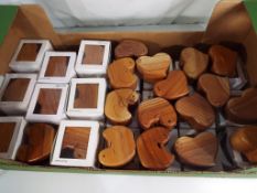 Unused retail stock - a quantity of approximately 35 carved wooden puzzles in the form of ducks and