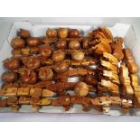 A quantity of carved wooden puzzle trinket boxes and novelty toys to include fourteen aligators,