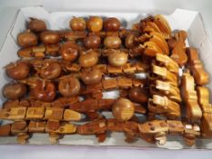 A quantity of carved wooden puzzle trinket boxes and novelty toys to include fourteen aligators,