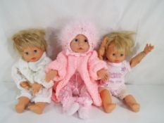 Dolls - a good quality clothed giggling and talking Lotus doll with arm and leg movement marked to