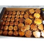 A quantity of approx twenty seven carved wooden trinket boxes in the form of apples and a further