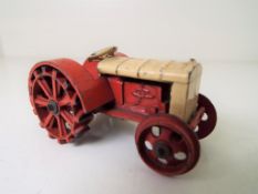 Dinky - a pre-war Farm Tractor, yellow and red body, red wheels lacking tow hook # 22E,