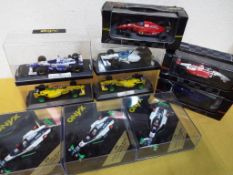 Ten diecast model racing cars predominantly Onyx,