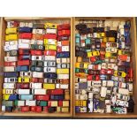 Two wooden trays containing in excess of 150 diecast model motor vehicles,