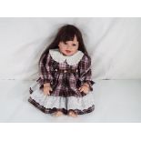 Reborn Doll - a good quality dressed doll (lifelike) with open mouth revealing two bottom teeth,