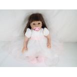 Reborn Doll - a good quality Reborn dressed doll (lifelike) with magnetic dummy / pacifier in