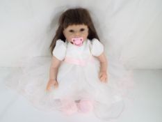 Reborn Doll - a good quality Reborn dressed doll (lifelike) with magnetic dummy / pacifier in