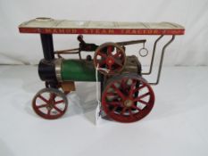 A Mamod steam tractor,