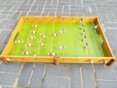 A vintage wooden table football set
