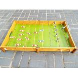 A vintage wooden table football set