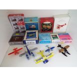 A collection of miniature model aeroplanes to include Schabak, Corgi and others,