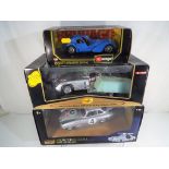 Three diecast scale models comprising Maisto 1:18 scale Mercedes Benz Ricko,