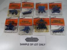 Ertl - Approximately 45 diecast metal implements by Ertl, in 1:64 scale, to include "Wing Disc",