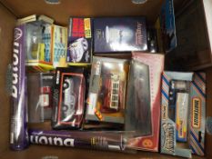 A mixed lot of diecast motor vehicles predominantly in original boxes to include ERTL Bat Mobile,