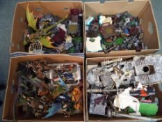 4 boxes containing a large quantity of Mega Bloks to include construction pieces,
