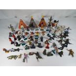 A quantity of toy soldiers, cowboys, Native Americans,