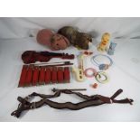 A good lot to include a vintage glockenspiel,a tin plate model of a violin with bow,