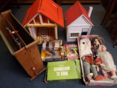 A large collection of toys to include a barn, a wooden dolls house, a wooden vintage table football,