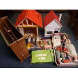 A large collection of toys to include a barn, a wooden dolls house, a wooden vintage table football,