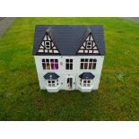 Doll's House - A good quality wooden doll's house, approximately 60 cm x 60 cm x 40 cm.