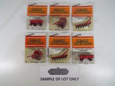 Ertl - Approximately 48 diecast metal implements by Ertl to include "International Harvester 6