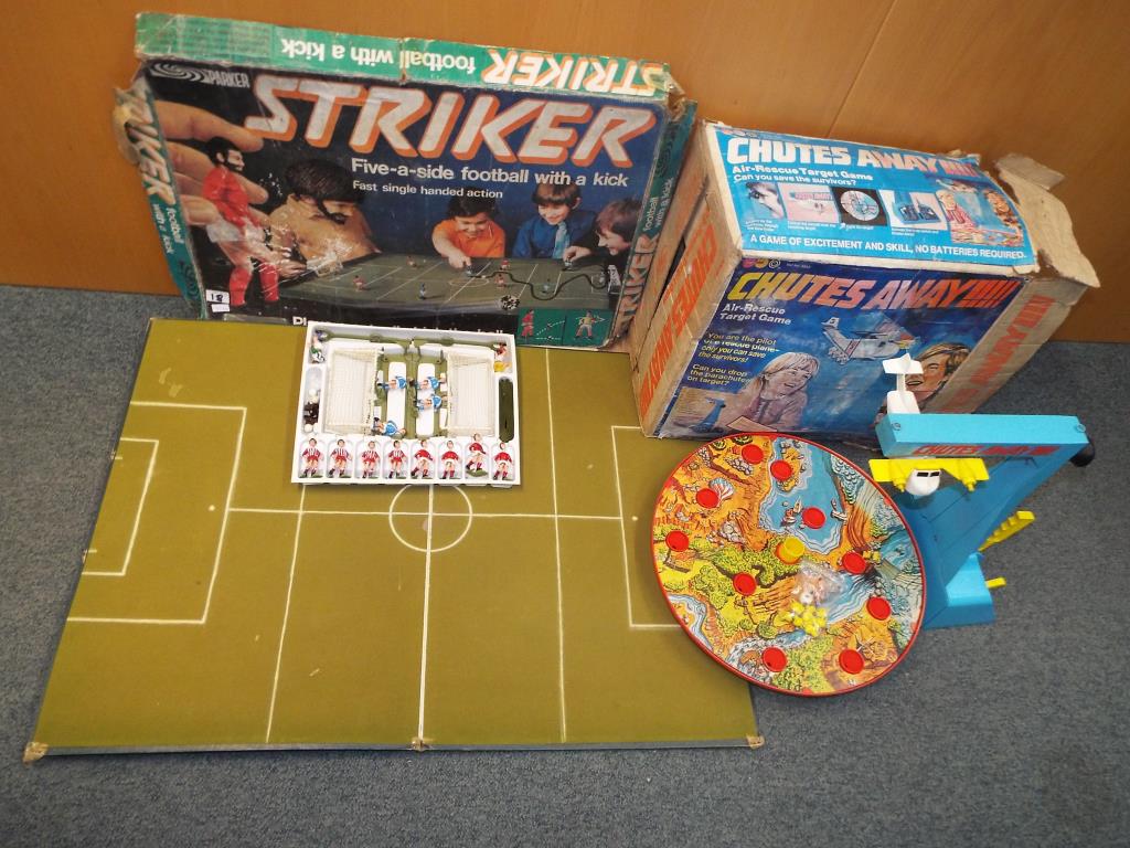 A Striker 5-aside football game with a kick table-top by Parker in original box and a Chutes Away