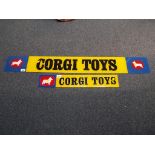 Corgi - two Corgi Toys advertising signs,