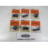 Ertl - 48 diecast metal implements by Ertl, all in 1:64 scale, to include "Ford Round Baler",