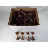 A large quantity of vintage wooden spinning tops.